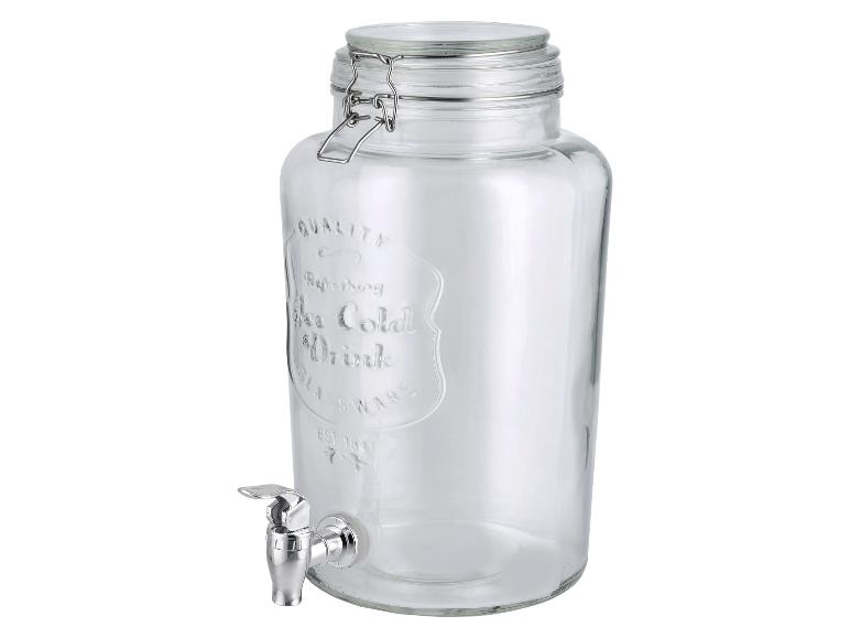 Distributeur de boissons en verre avec robinet, couvercle à charnière et texte en relief.