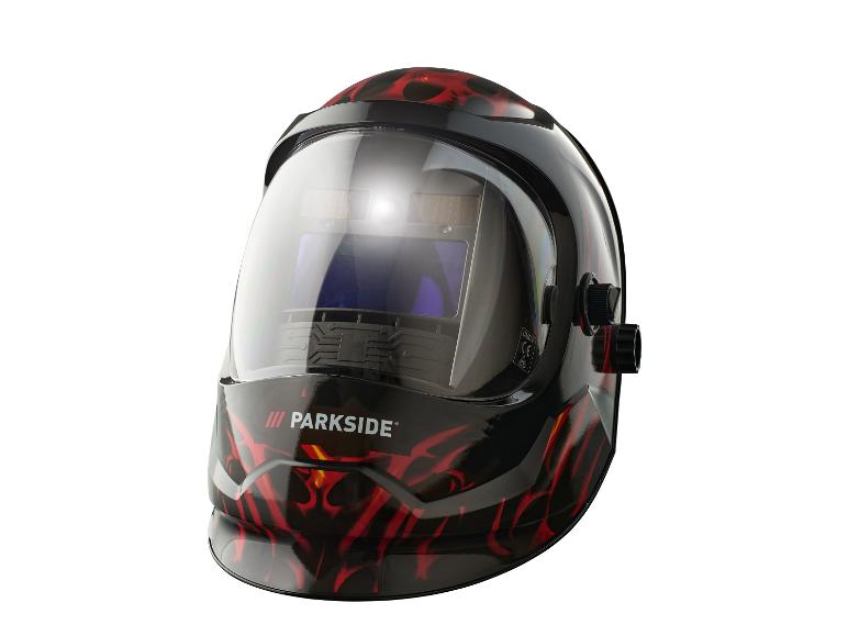 Un casque de soudeur noir avec des flammes rouges et le logo Parkside.