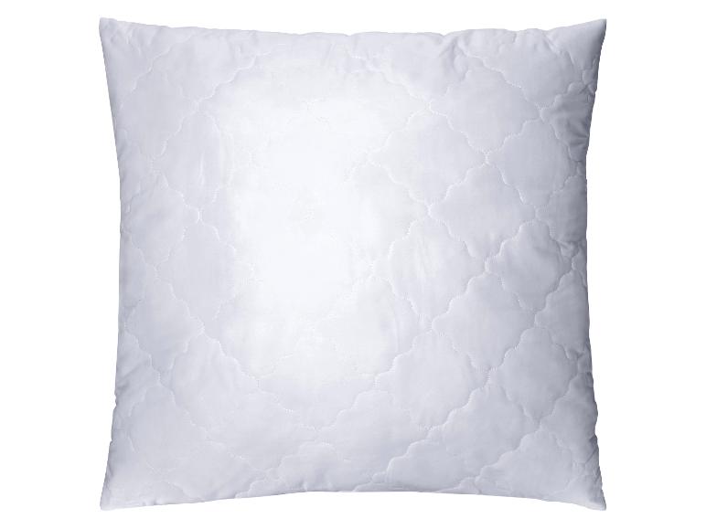 Oreiller blanc matelassé avec motif décoratif