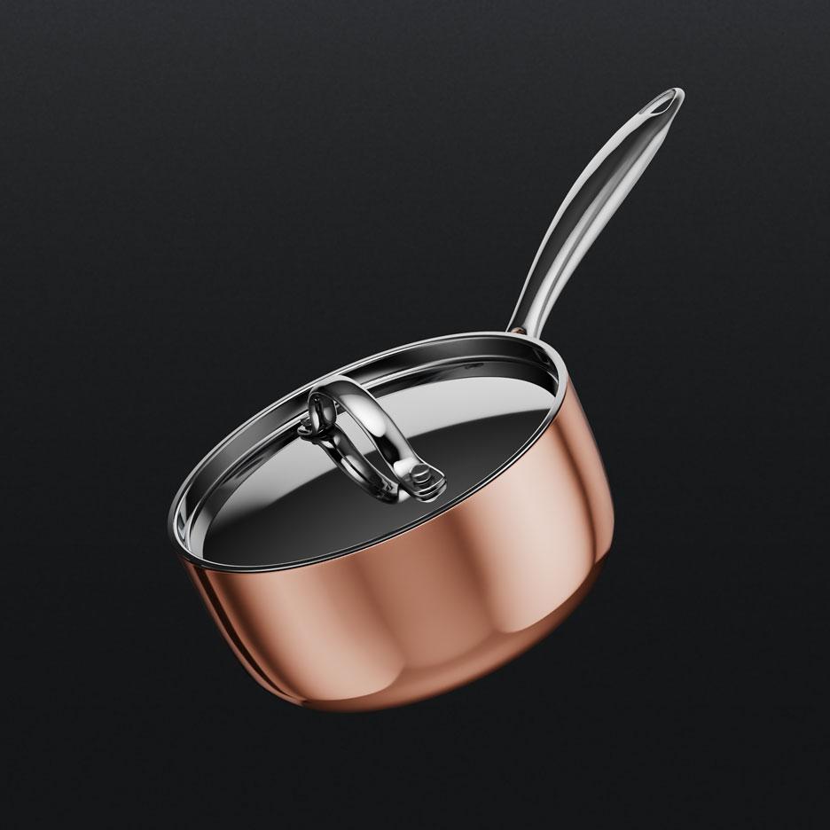 Casserole couleur cuivre avec couvercle et poignée métallique.