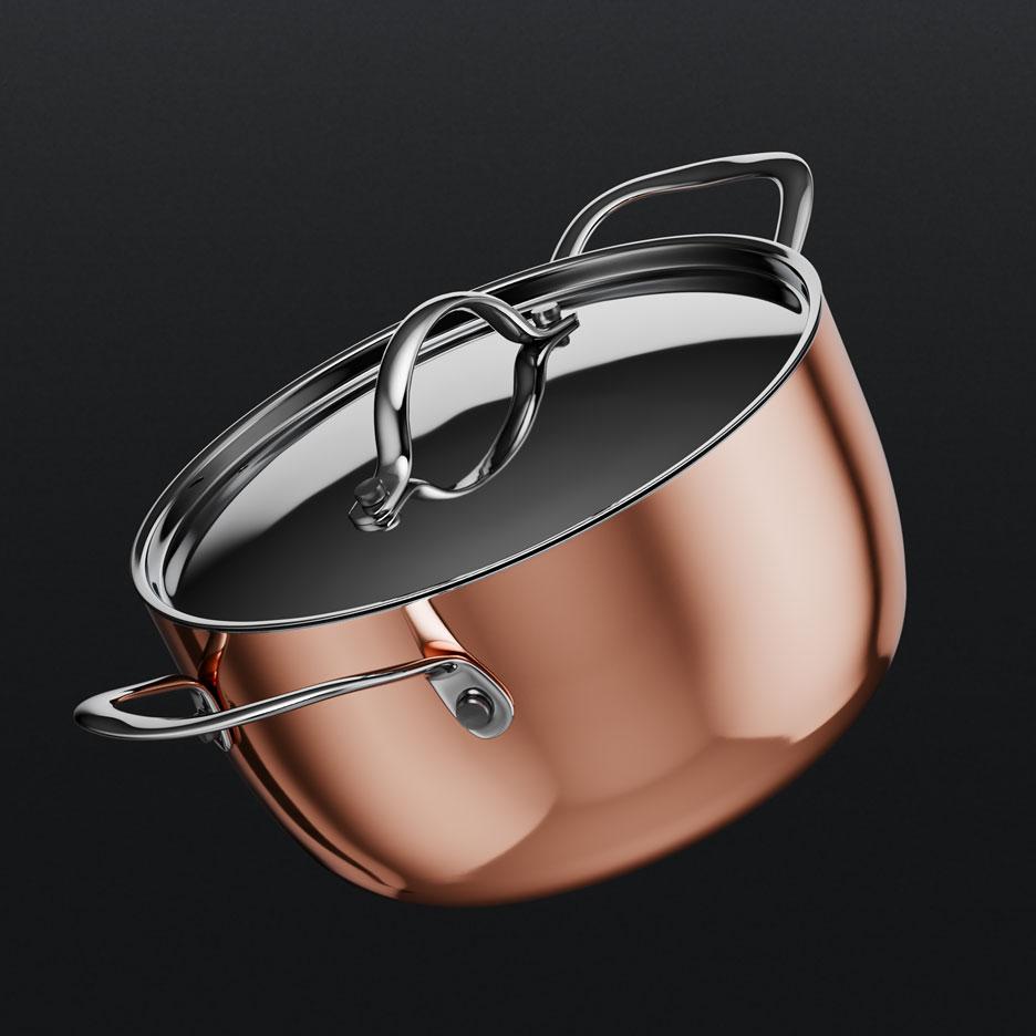 Casserole en cuivre avec couvercle et poignées en acier inoxydable.