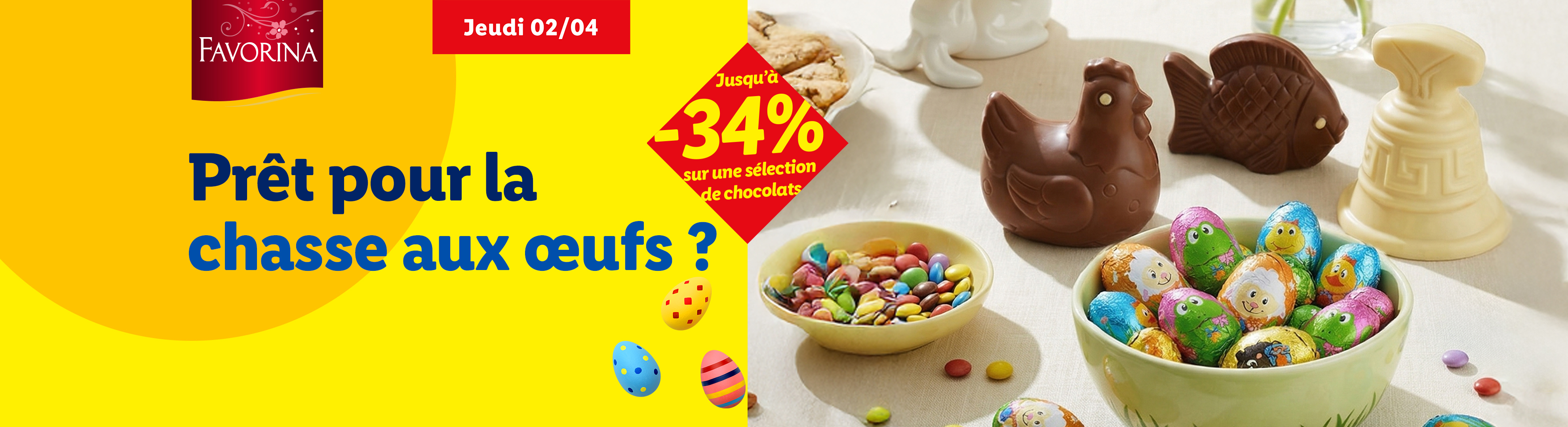 Chocolats de Pâques en forme de poule, poisson et cloche, avec des œufs et bonbons colorés, sur fond jaune avec le texte 'Prêt pour la chasse aux œufs ?' et une offre de -34%.