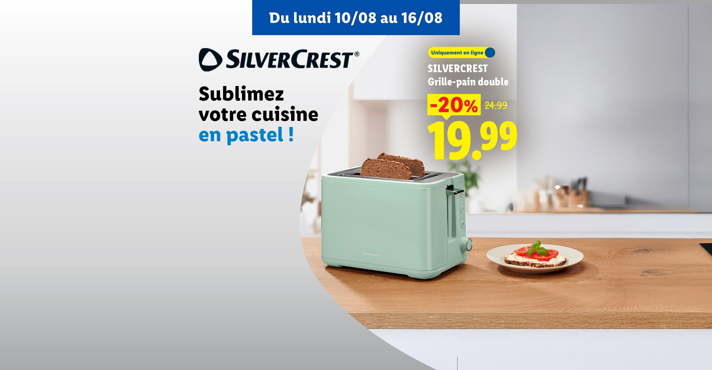 Un grille-pain double vert pastel avec du pain grillé, sur une table en bois, avec une offre promotionnelle.