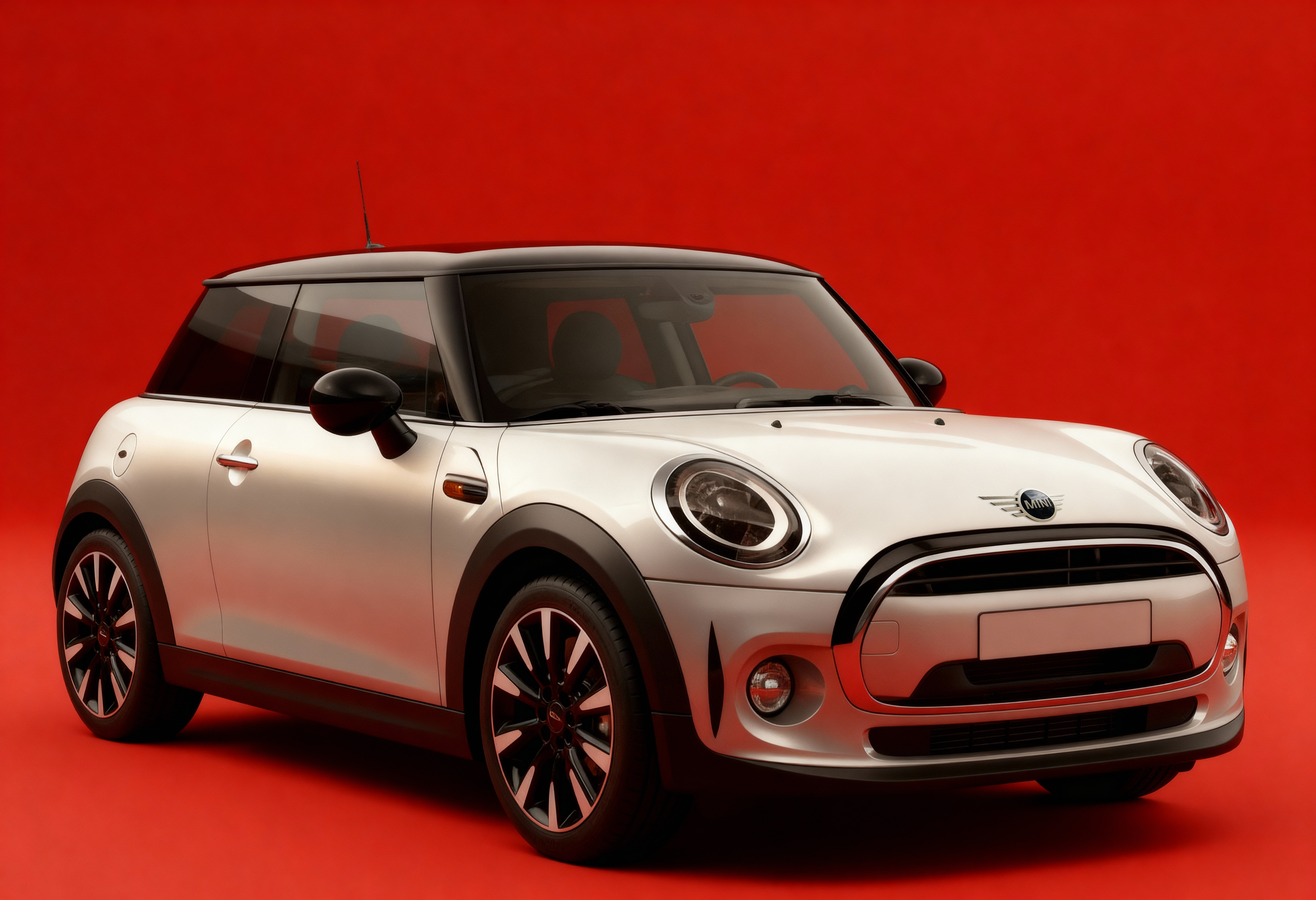 Mini Cooper blanche sur fond rouge vif.