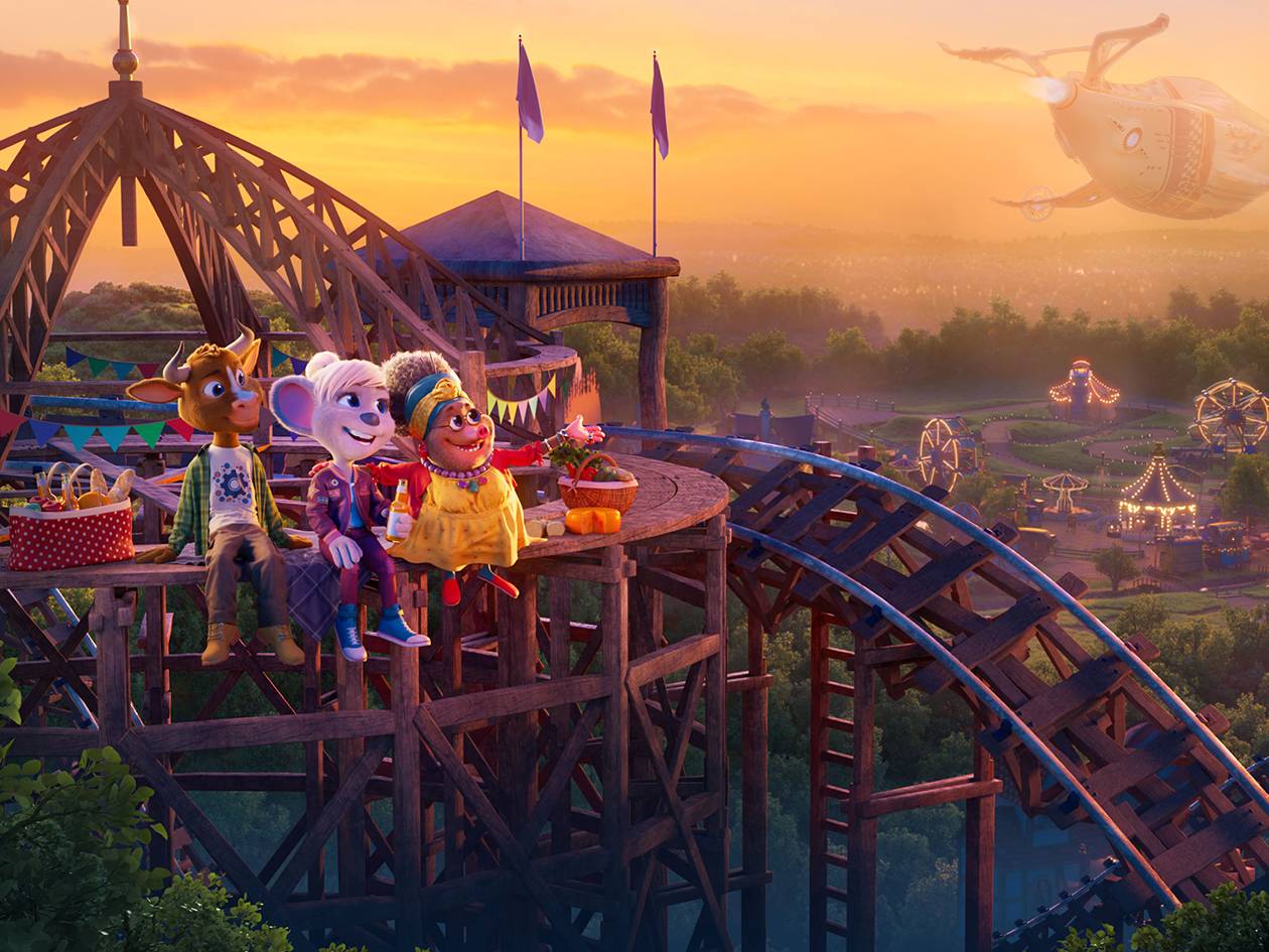 Trois personnages de dessin animé profitent d'une vue imprenable sur un parc d'attractions au coucher du soleil.